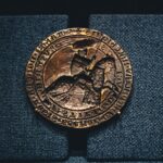 Detailed close-up of an ancient coin depicting a knight, showcasing intricate design and historical significance.